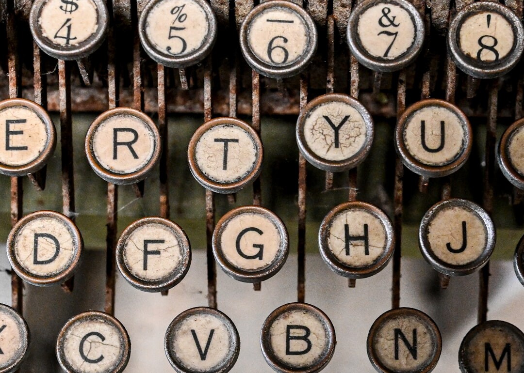 Close-up of vintage typewriter keys with a sheet of paper