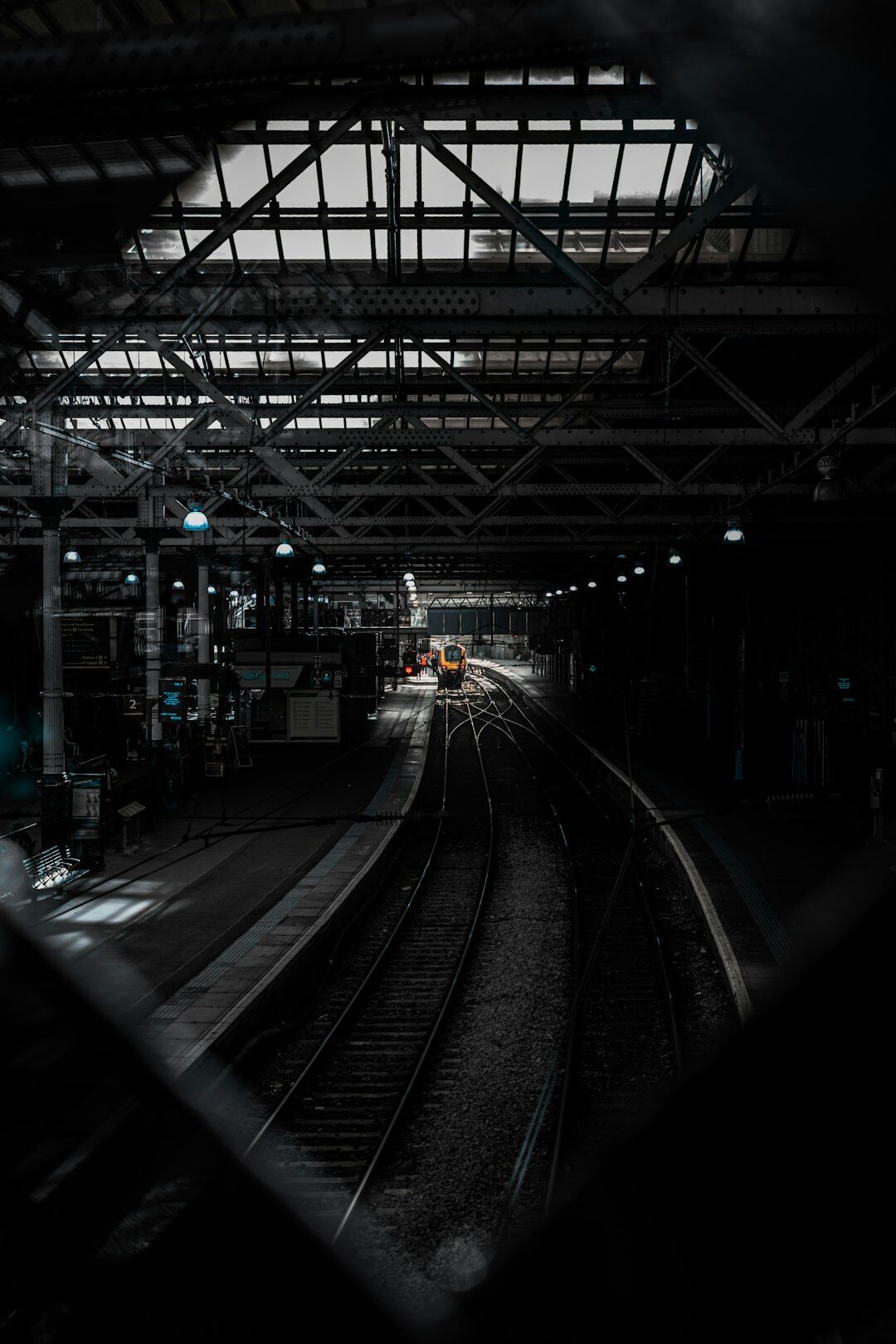 Dark moody book cover style image of a midnight train station